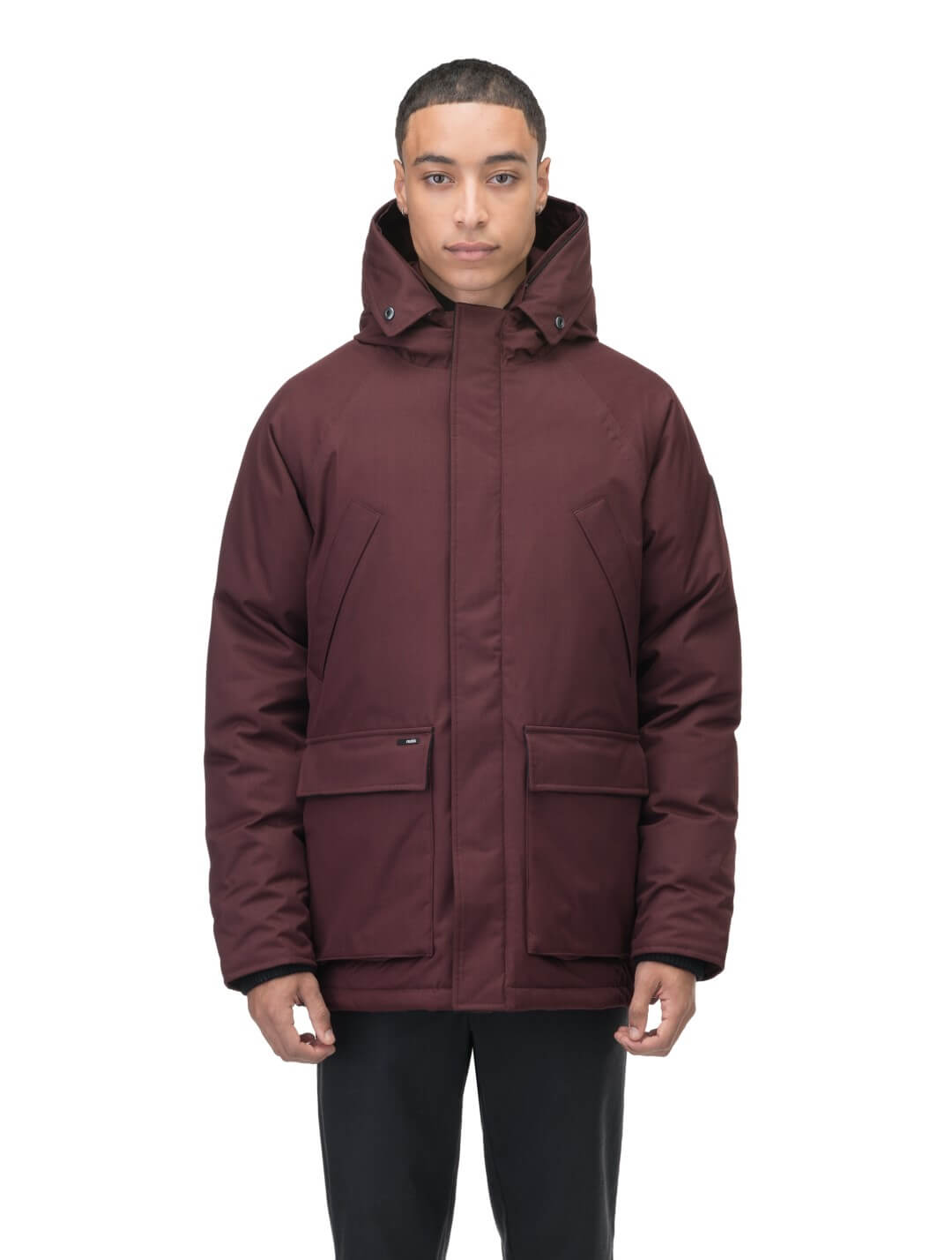 Men's waist length down filled jacket with two front pockets with magnetic closure and a removable fur trim on the hood in Merlot