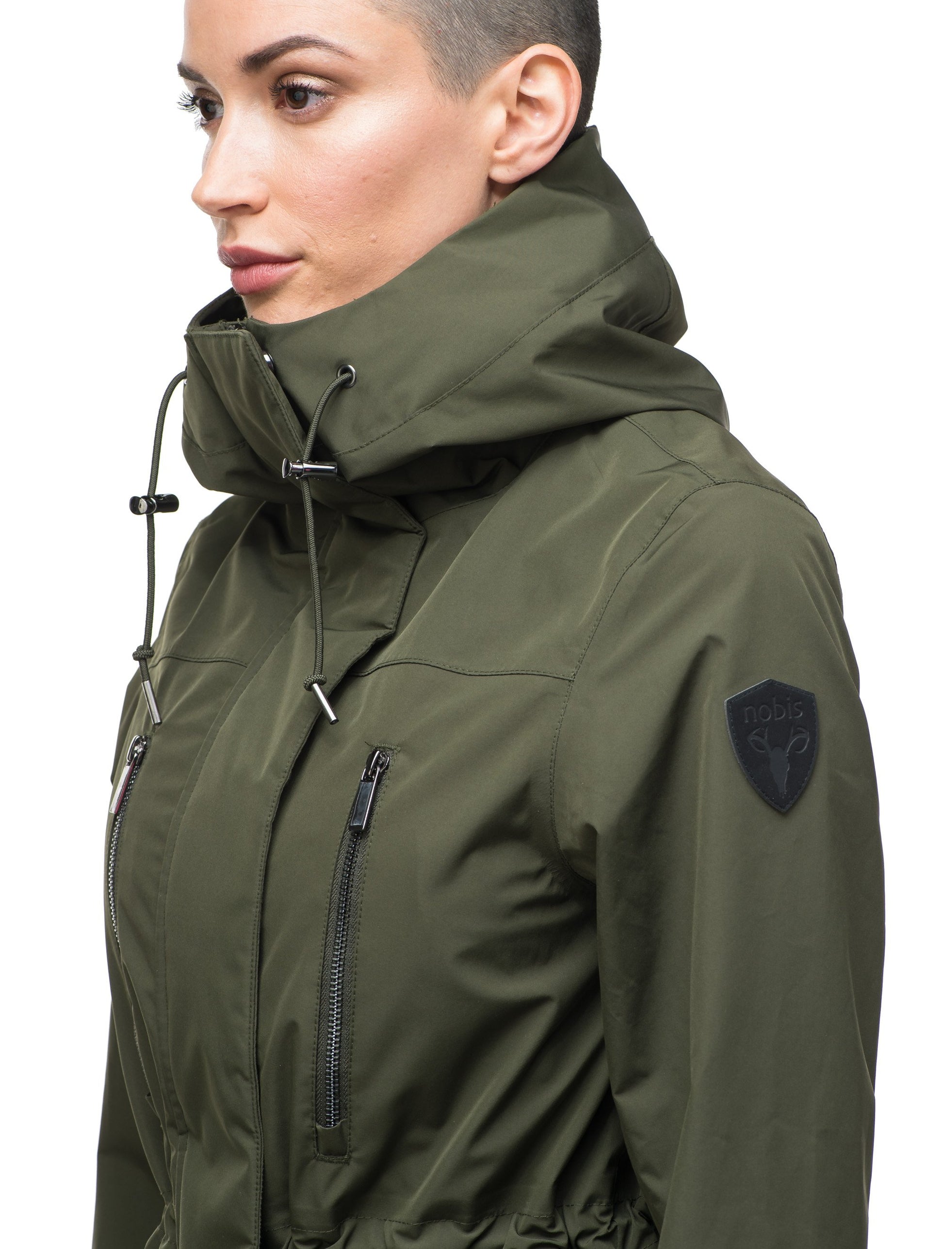 Women's knee length anorak with four front pockets and adjustable cord waist in Fatigue