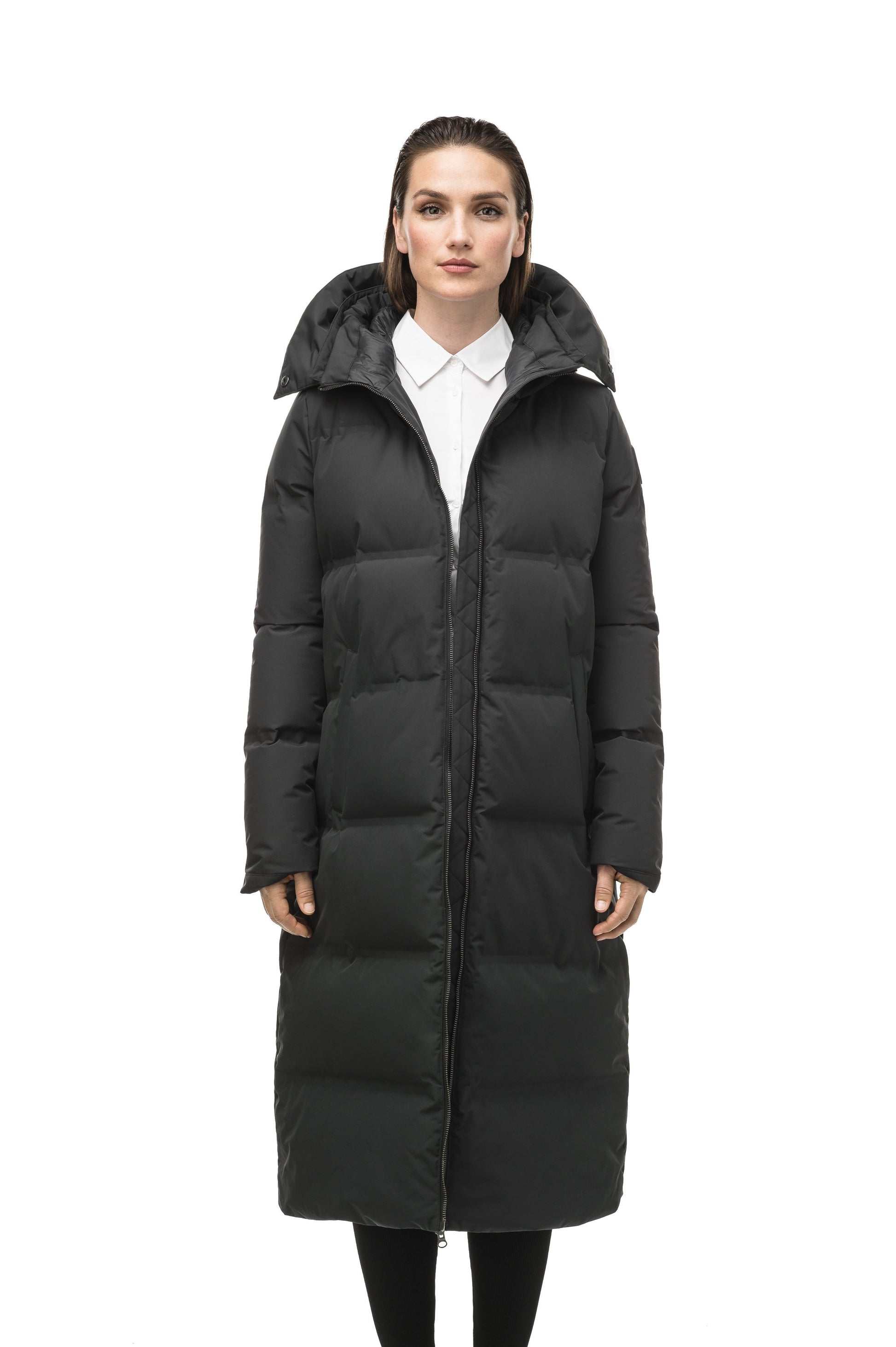 Women's ankle length puffer jacket with a minimalist modern design,ÃƒÆ’Ã†â€™Ãƒâ€ Ã¢â‚¬â„¢ÃƒÆ’Ã¢â‚¬Â ÃƒÂ¢Ã¢â€šÂ¬Ã¢â€žÂ¢ÃƒÆ’Ã†â€™Ãƒâ€šÃ‚Â¢ÃƒÆ’Ã‚Â¢ÃƒÂ¢Ã¢â€šÂ¬Ã…Â¡Ãƒâ€šÃ‚Â¬ÃƒÆ’Ã¢â‚¬Â¦Ãƒâ€šÃ‚Â¡ÃƒÆ’Ã†â€™Ãƒâ€ Ã¢â‚¬â„¢ÃƒÆ’Ã‚Â¢ÃƒÂ¢Ã¢â‚¬Å¡Ã‚Â¬Ãƒâ€¦Ã‚Â¡ÃƒÆ’Ã†â€™ÃƒÂ¢Ã¢â€šÂ¬Ã…Â¡ÃƒÆ’Ã¢â‚¬Å¡Ãƒâ€šÃ‚Â featuring an exposed zipper, and seamless puffer channels in Black