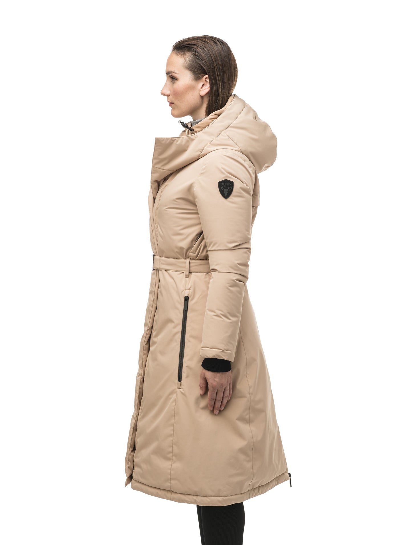 Long calf length hooded women's winter parka with an inner hip length closure, exterior hem length zipper and magentic placket in Fawn