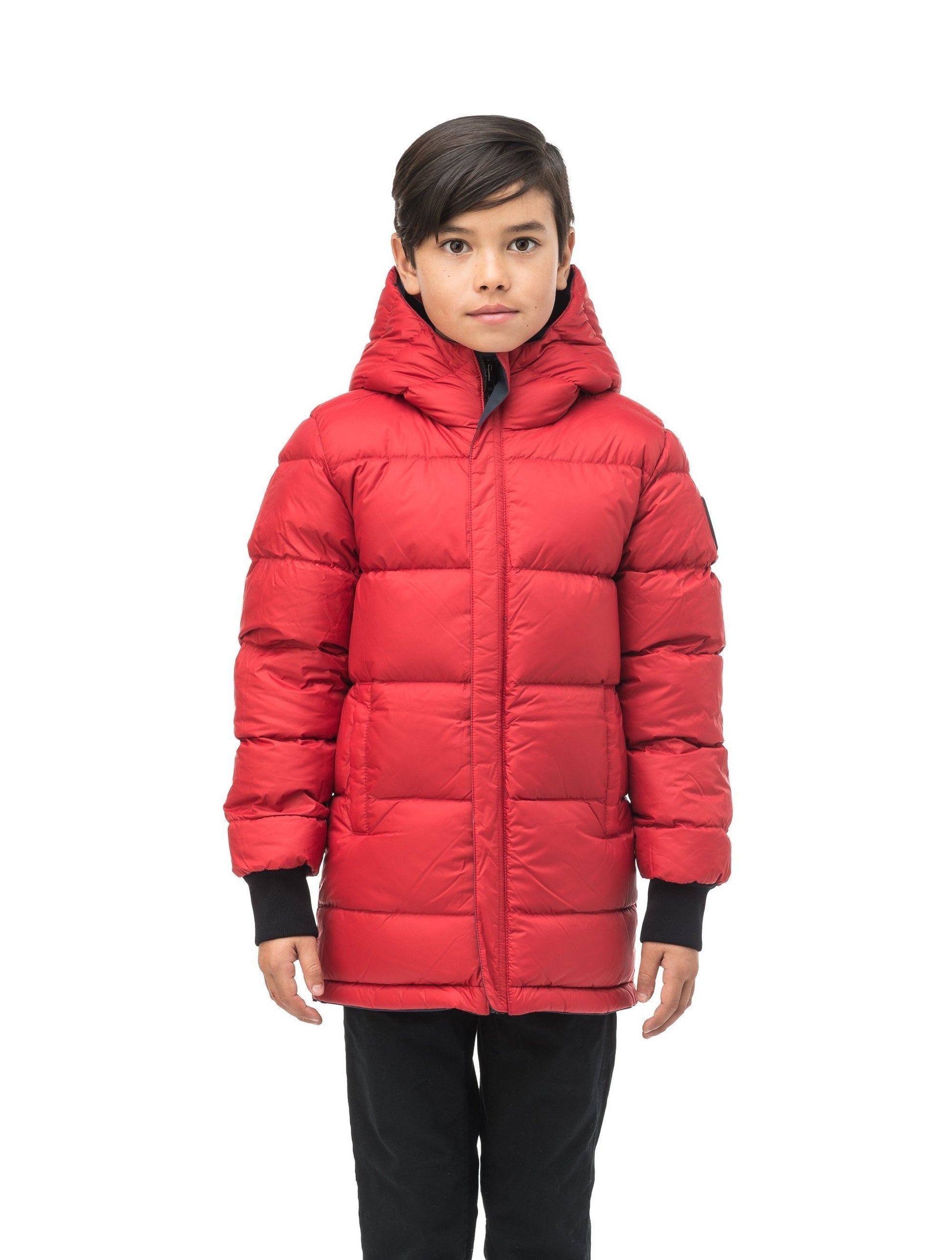 Kids' reversible knee length, down filled parka with waterproof finish in Navy Camo/Vermillion