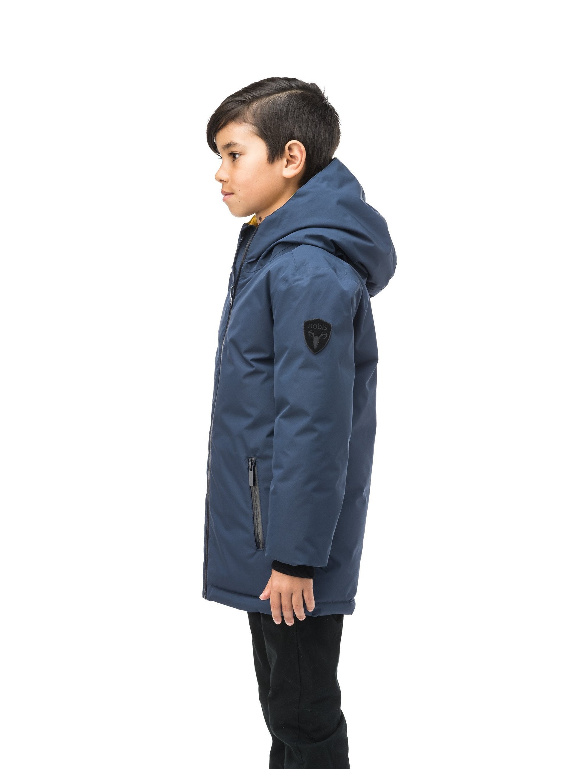 Kids' reversible knee length, down filled parka with waterproof finish in Marine/Citron