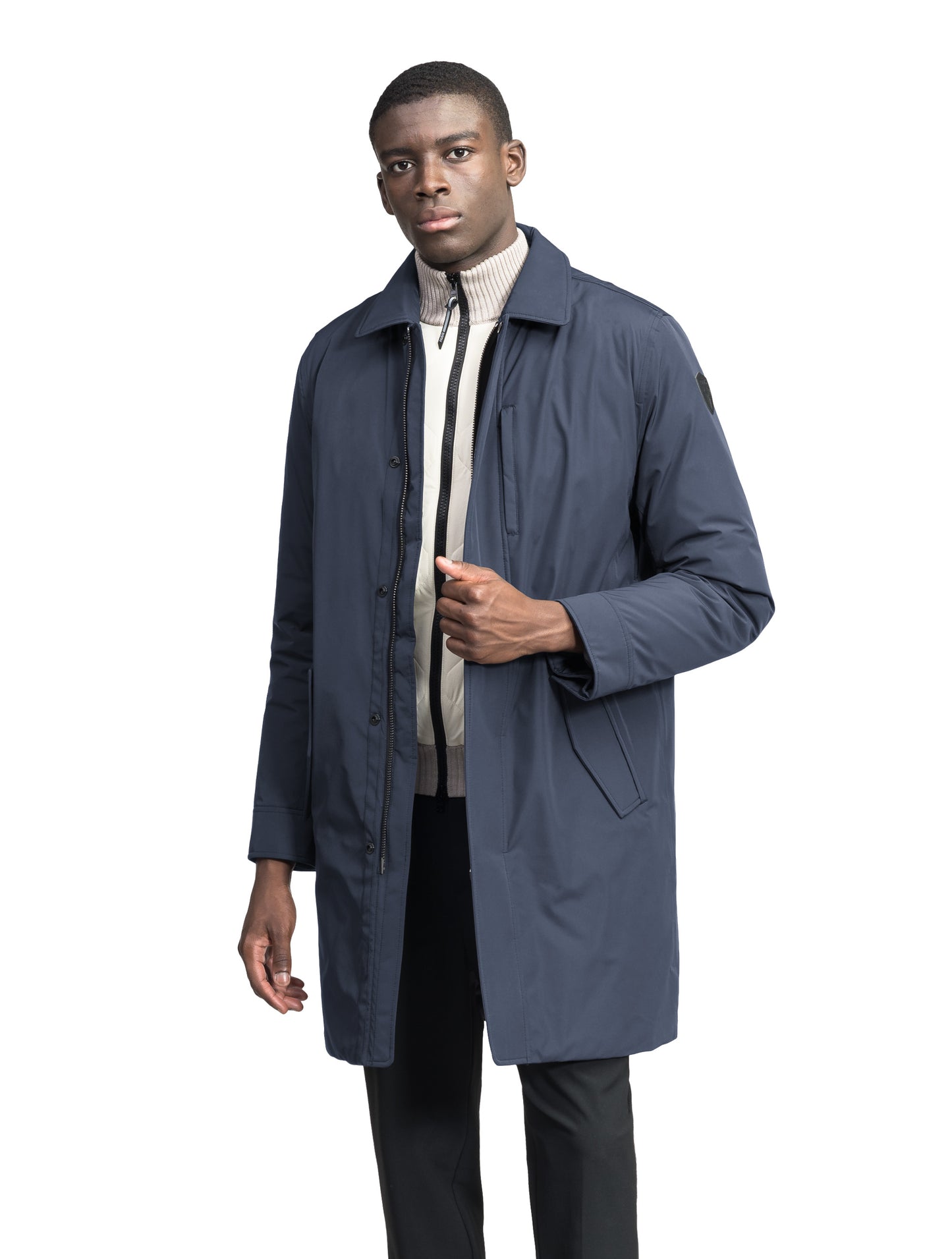 Nord Men's Tailored Trench Coat in knee length, 3-Ply Micro Denier and 4-Way Durable Stretch Weave fabrication, Premium Canadian White Duck Down insulation, removable down-filled hood, exterior zipper pocket at left chest, and adjustable snap button cuffs, in Marine