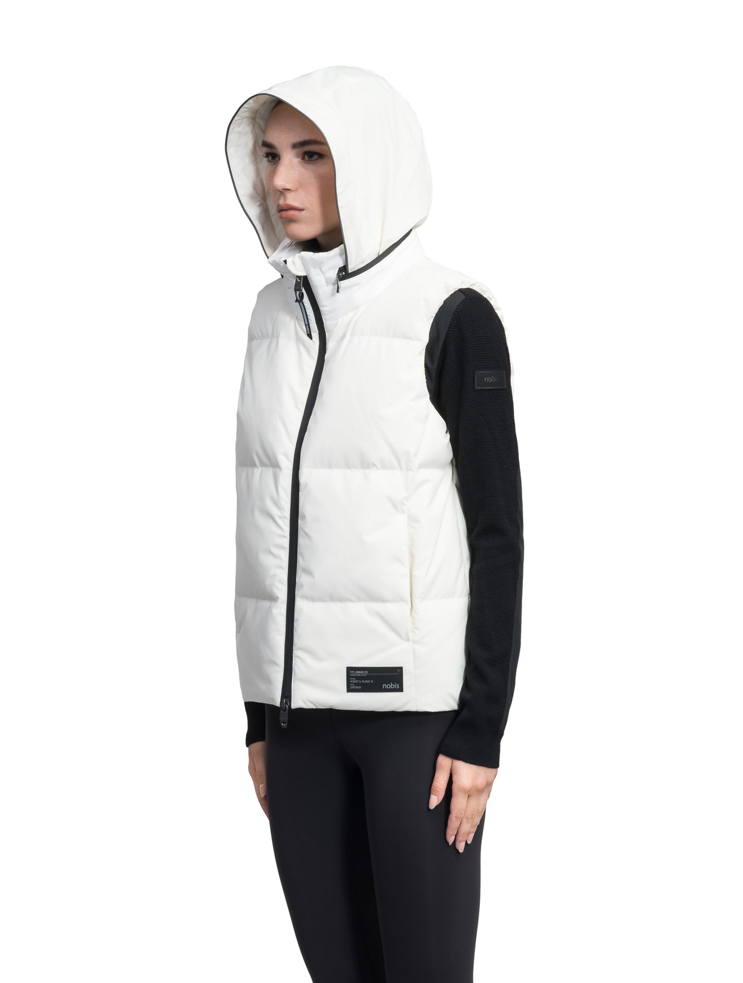 Oren Ladies Performance Vest in hip length, Durable Stretch Ripstop and 3-Ply Micro Denier fabrication, Premium Canadian White Duck Down insulation, tuck-away waterproof hood, and two-way centre front zipper, in Chalk