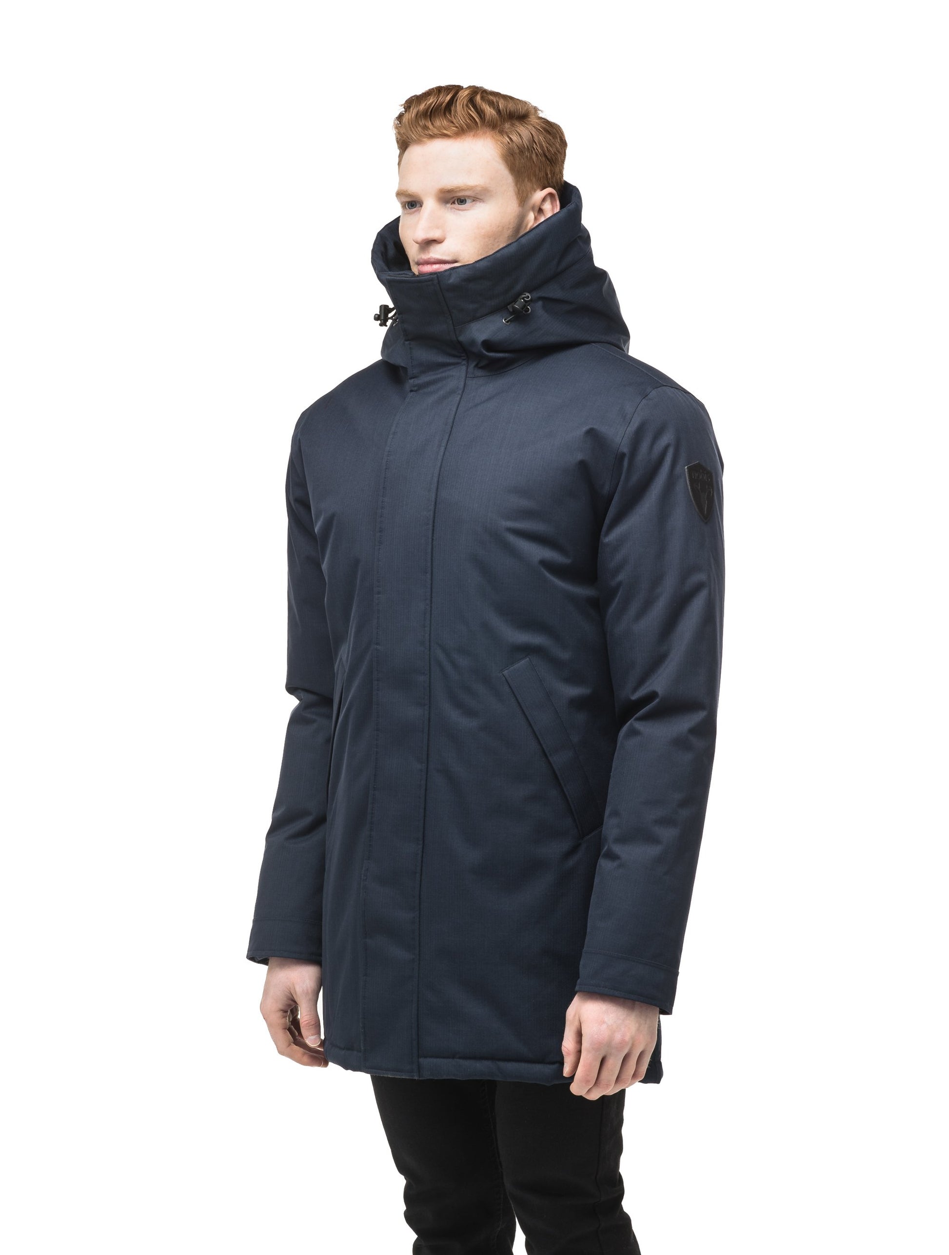 Pierre Men's Jacket in thigh length, Canadian white duck down insulation, non-removable down-filled hood, angled waist pockets, centre-front zipper with wind flap, and elastic ribbed cuffs, in CH Navy