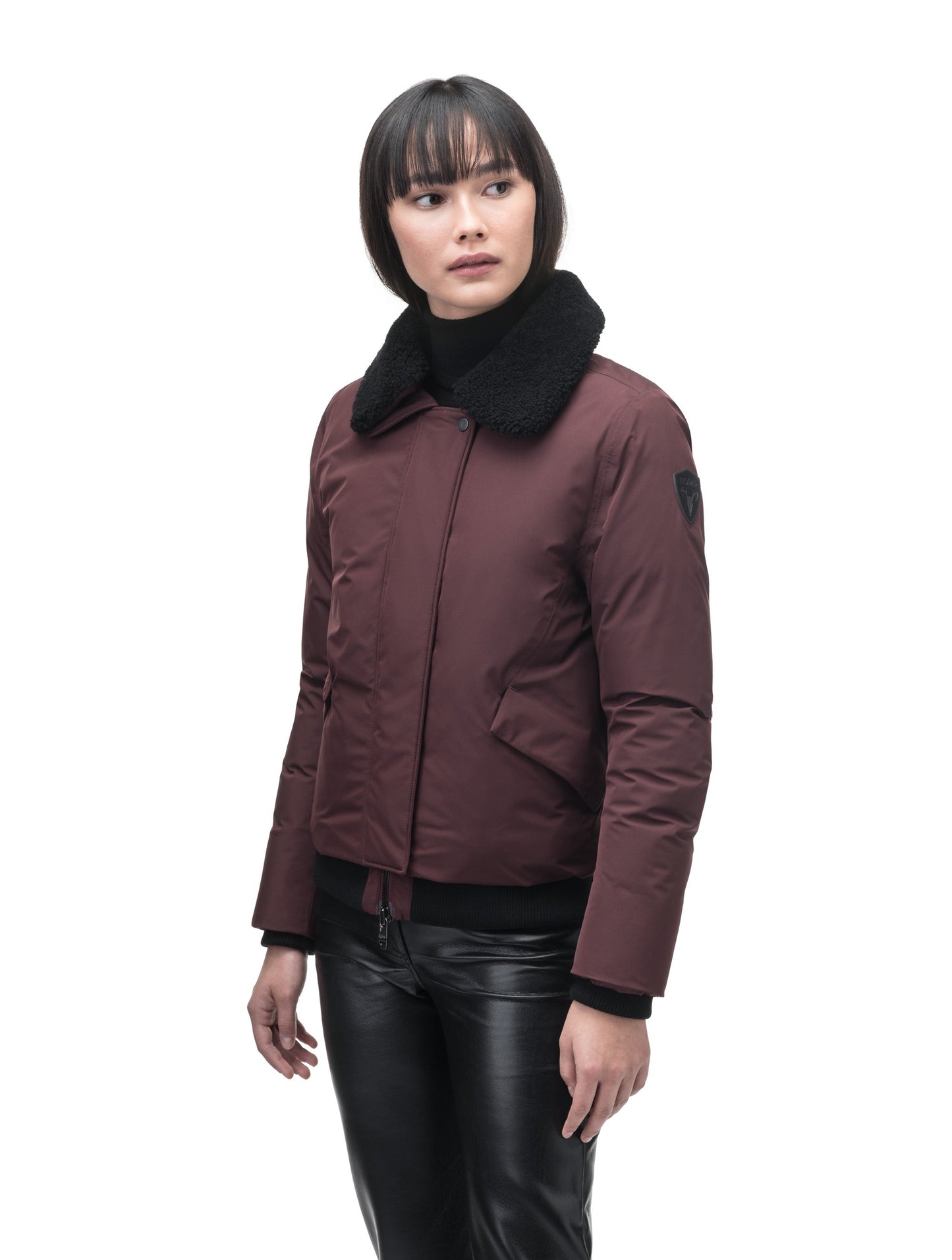 Rae Ladies Aviator Jacket in hip length, Canadian duck down insulation, removable shearling collar with hidden tuckable hood, and two-way front zipper, in Merlot