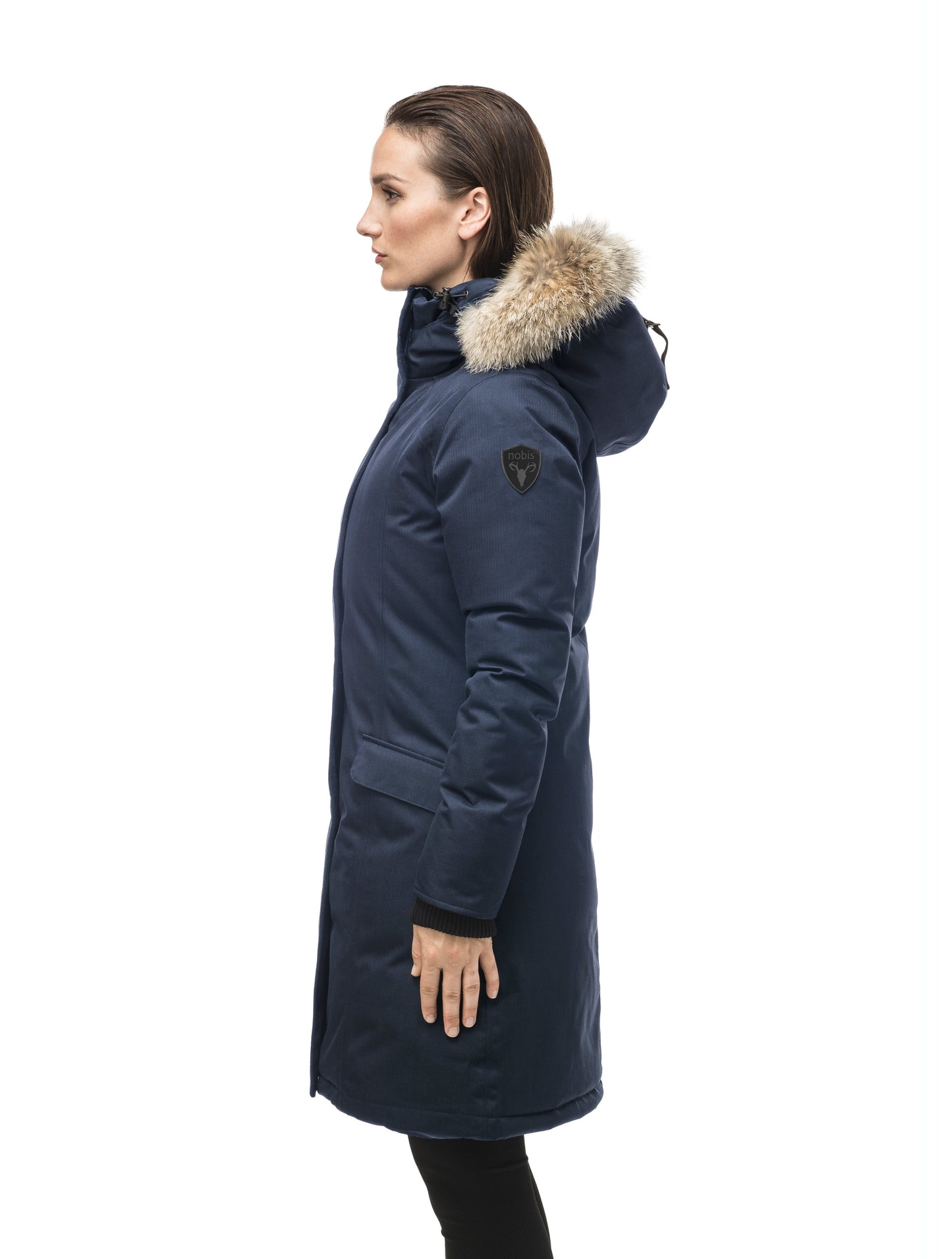 Rebecca Women's Parka in knee length, Canadian duck down insulation, two-way zipper with magnetic front placket, non-removable hood with removable coyote fur trim, in Navy