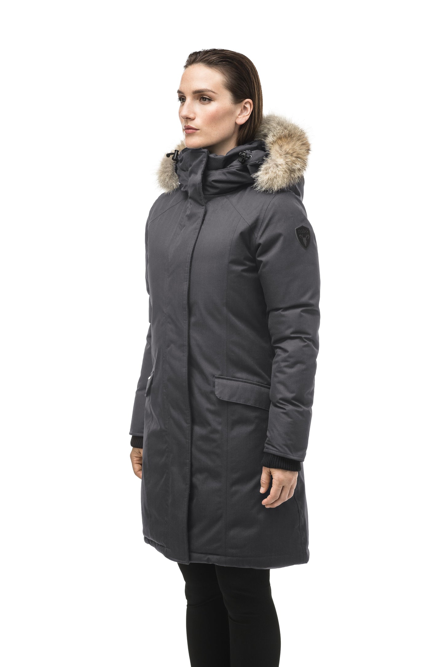 Rebecca Women's Parka in knee length, Canadian duck down insulation, two-way zipper with magnetic front placket, non-removable hood with removable coyote fur trim, in Steel Grey