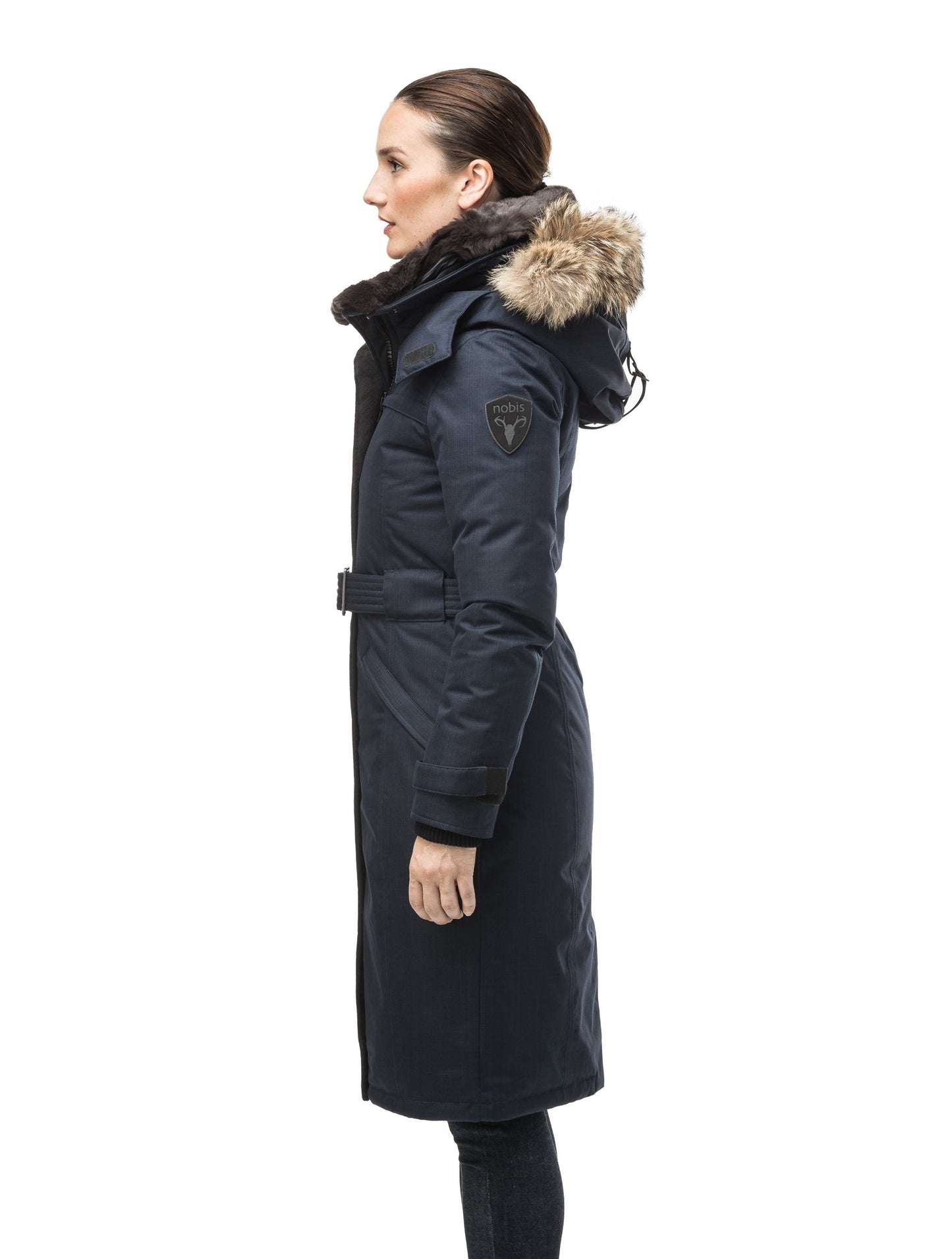 Women's knee length down filled parka with a belted waist and fully removable Coyote and Rex Rabbit fur ruffs in CH Navy