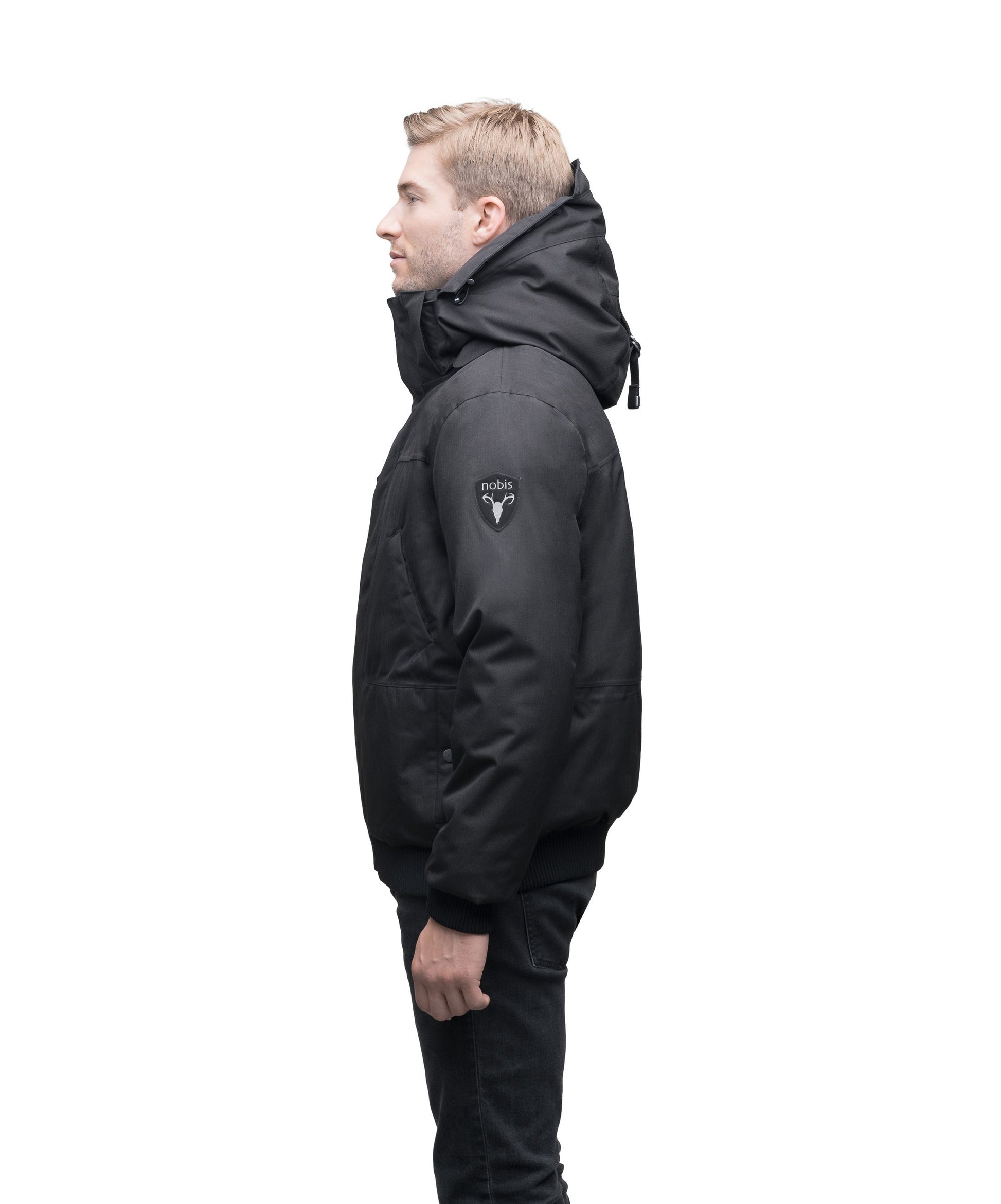 Men's sleek down filled bomber jacket with clean details and a fur free hood in CH Black