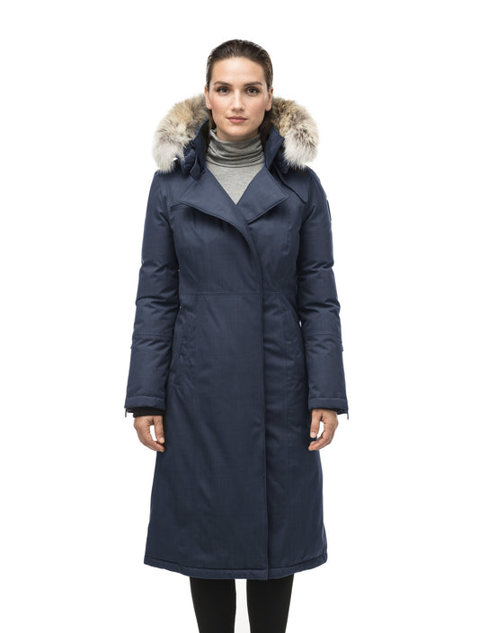 Long calf length women's trench inspired parka with removable fur trim around the hood and an asymetric closure in Navy