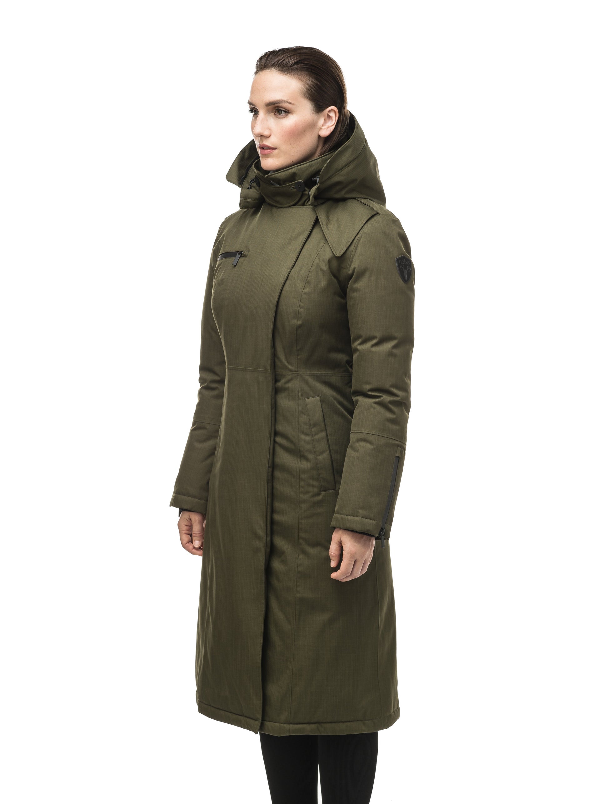 Long calf length women's trench inspired parka with removable fur trim around the hood and an asymetric closure in Fatigue