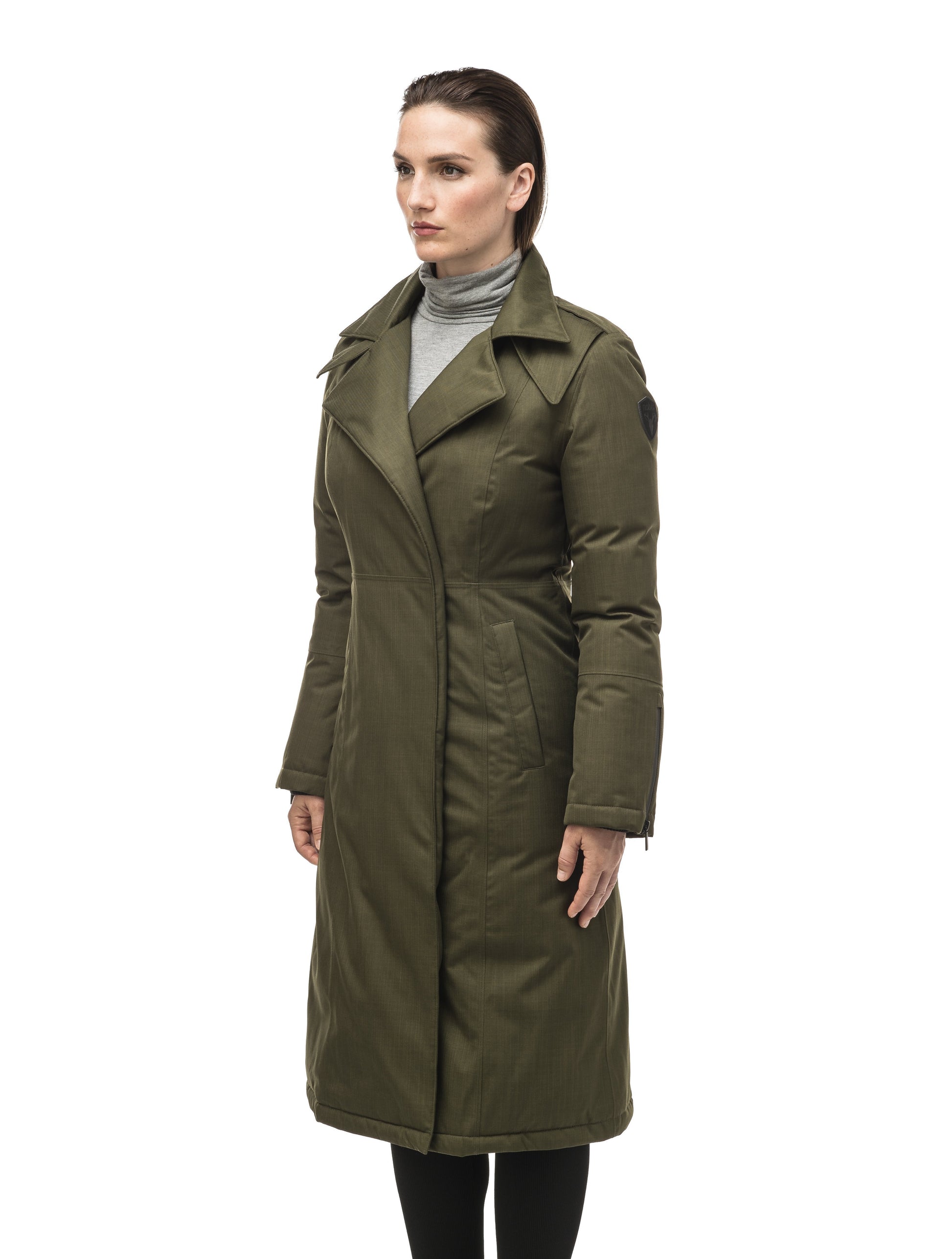 Long calf length women's trench inspired parka with removable fur trim around the hood and an asymetric closure in Fatigue