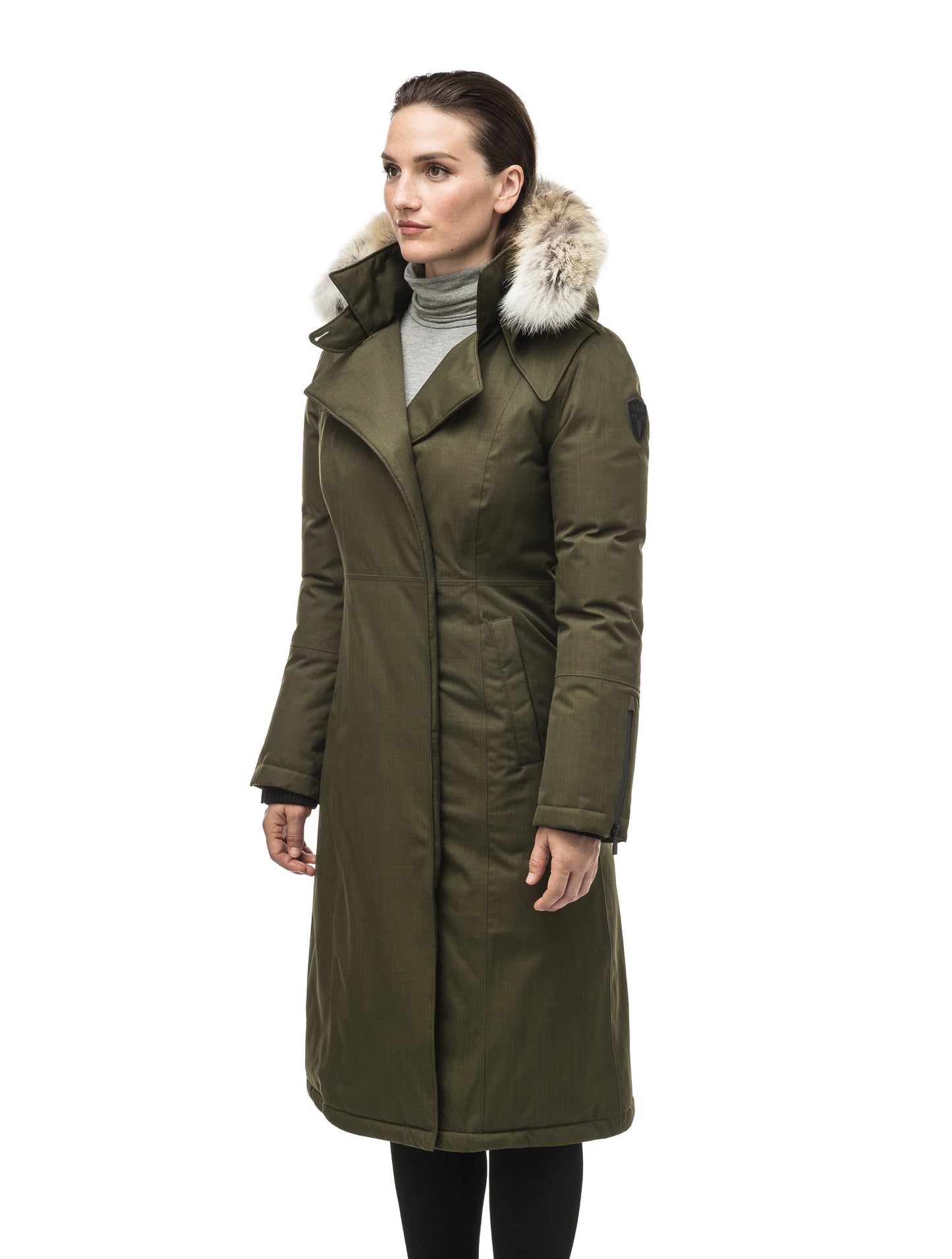 Long calf length women's trench inspired parka with removable fur trim around the hood and an asymetric closure in Fatigue