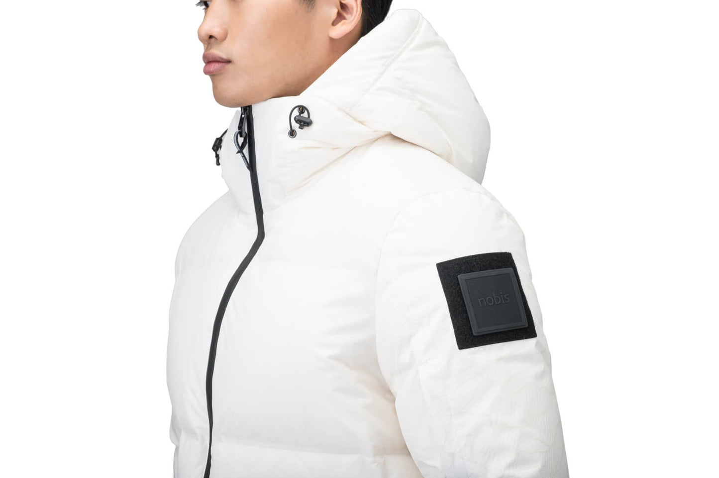 Supra Men's Performance Puffer in hip length, Technical Taffeta and 3-Ply Micro Denier fabrication, Premium Canadian White Duck Down insulation, non-removable down filled hood, centre front two-way zipper, flap pockets at waist, and zipper pocket at left bicep, in Wheat Desert