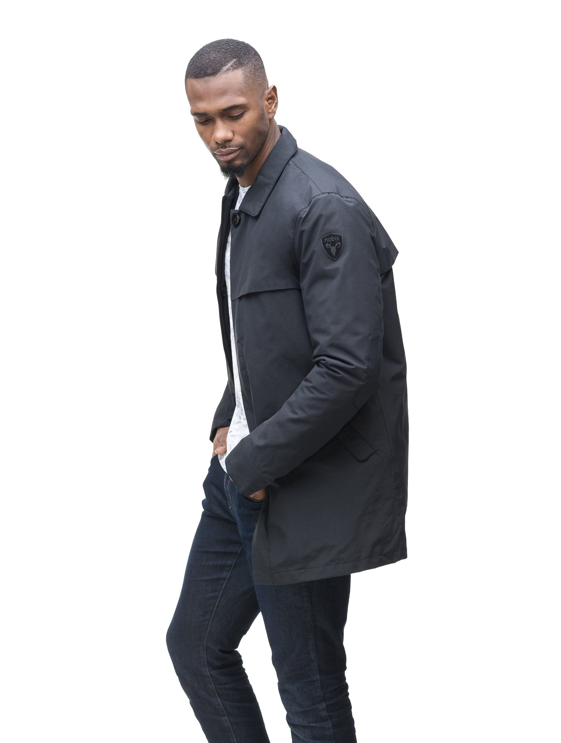 Men's waist length raincoat with a magnetic placket and top button detail in Navy