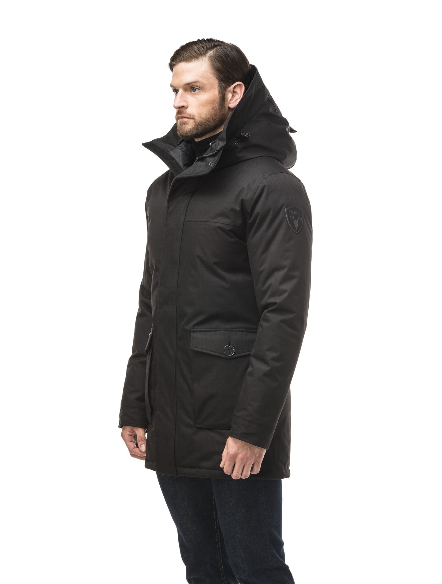 Men's slim fitting waist length parka with removable fur trim on the hood and two waist patch pockets in CH Black