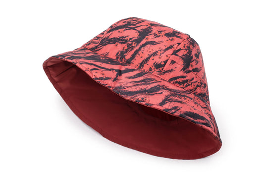 Lunar New Year Reversible Bucket Hat with one side in red tiger print, and the reverse side in tonal red with Nobis label branding on the crown front, in Vermillion