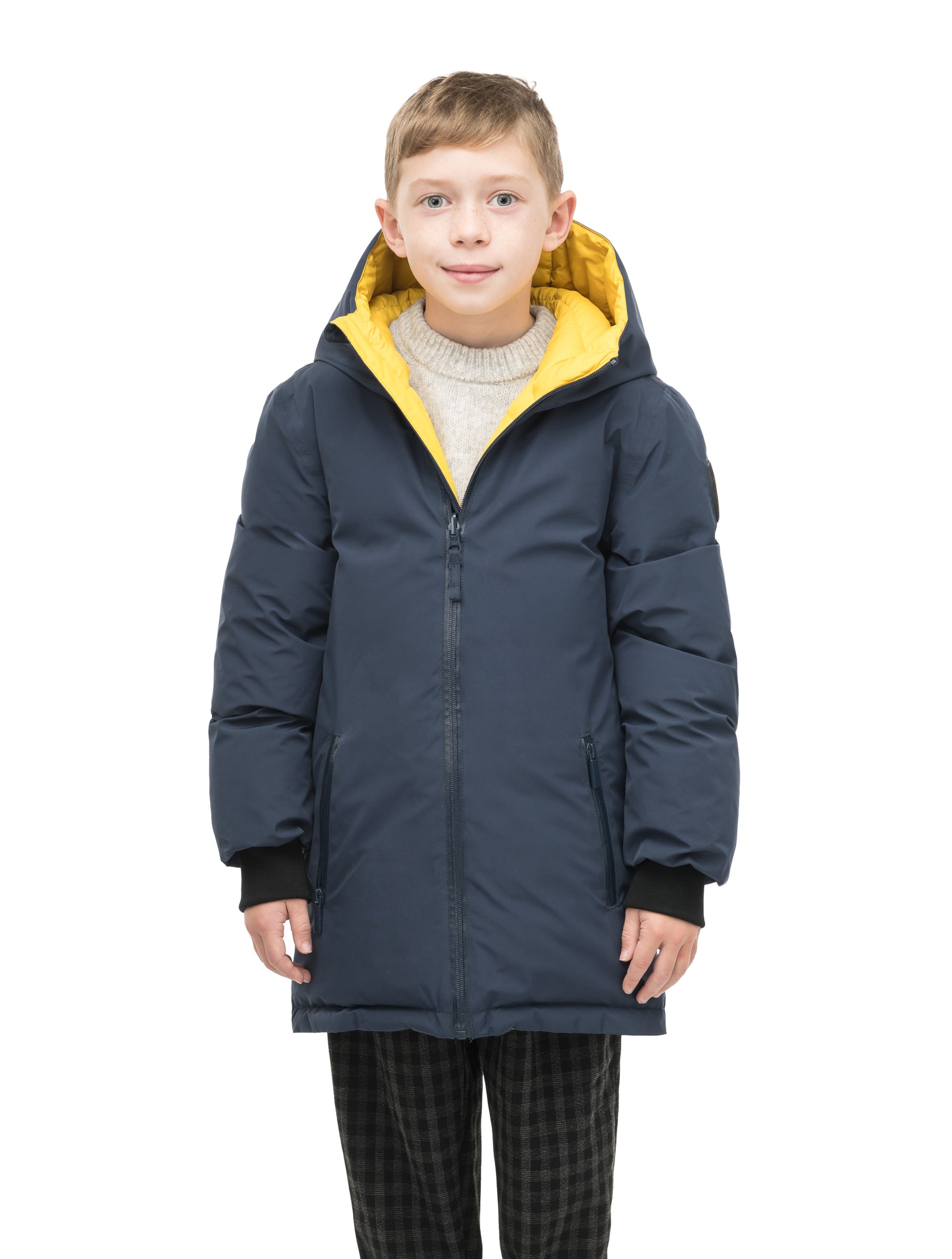 Kids' reversible knee length, down filled parka with waterproof finish in Marine/Citron