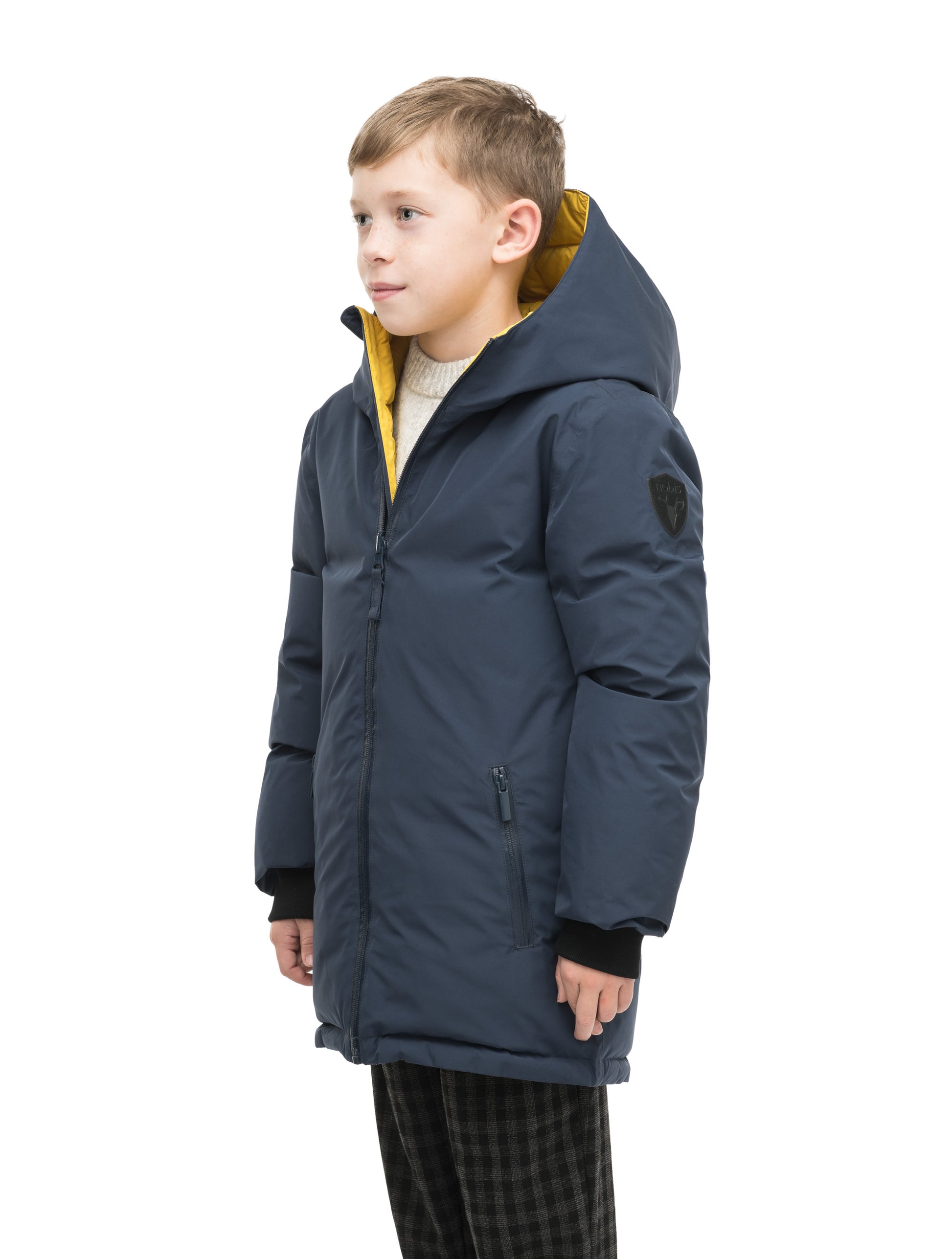 Kids' reversible knee length, down filled parka with waterproof finish in Marine/Citron